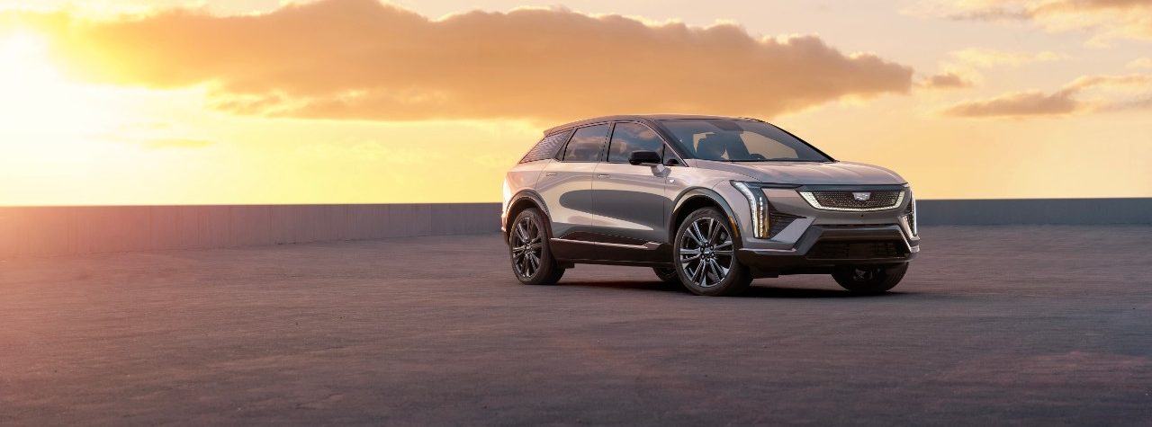 2025 Cadillac Optiq in silver with sunset backdrop